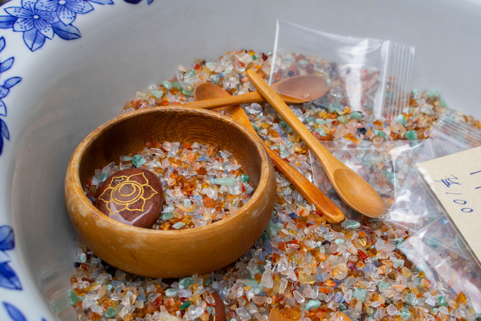 vibratory rock tumbler bowl filled with small glass fragments and water