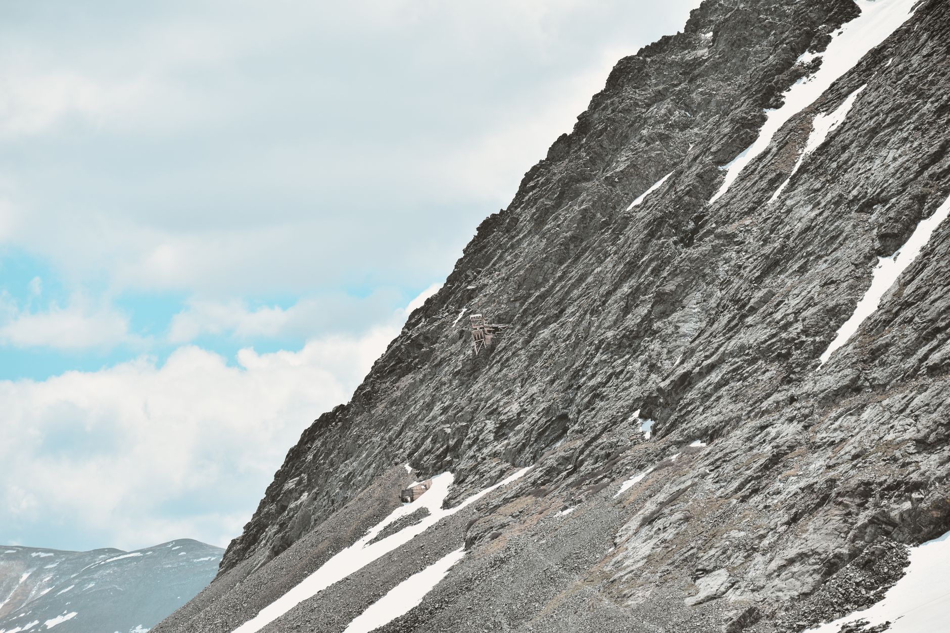 two rockhounds collecting minerals on a high-altitude Colorado mountain slope