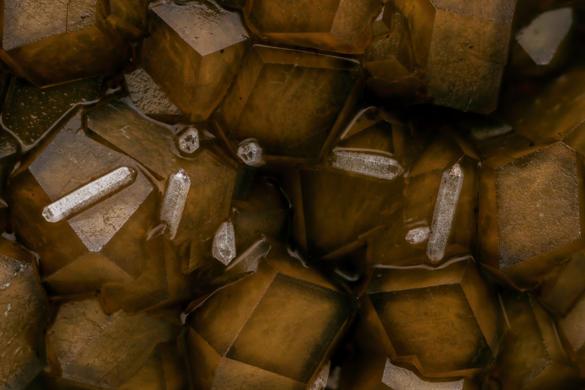 green emerald crystals embedded in gray mica schist rock