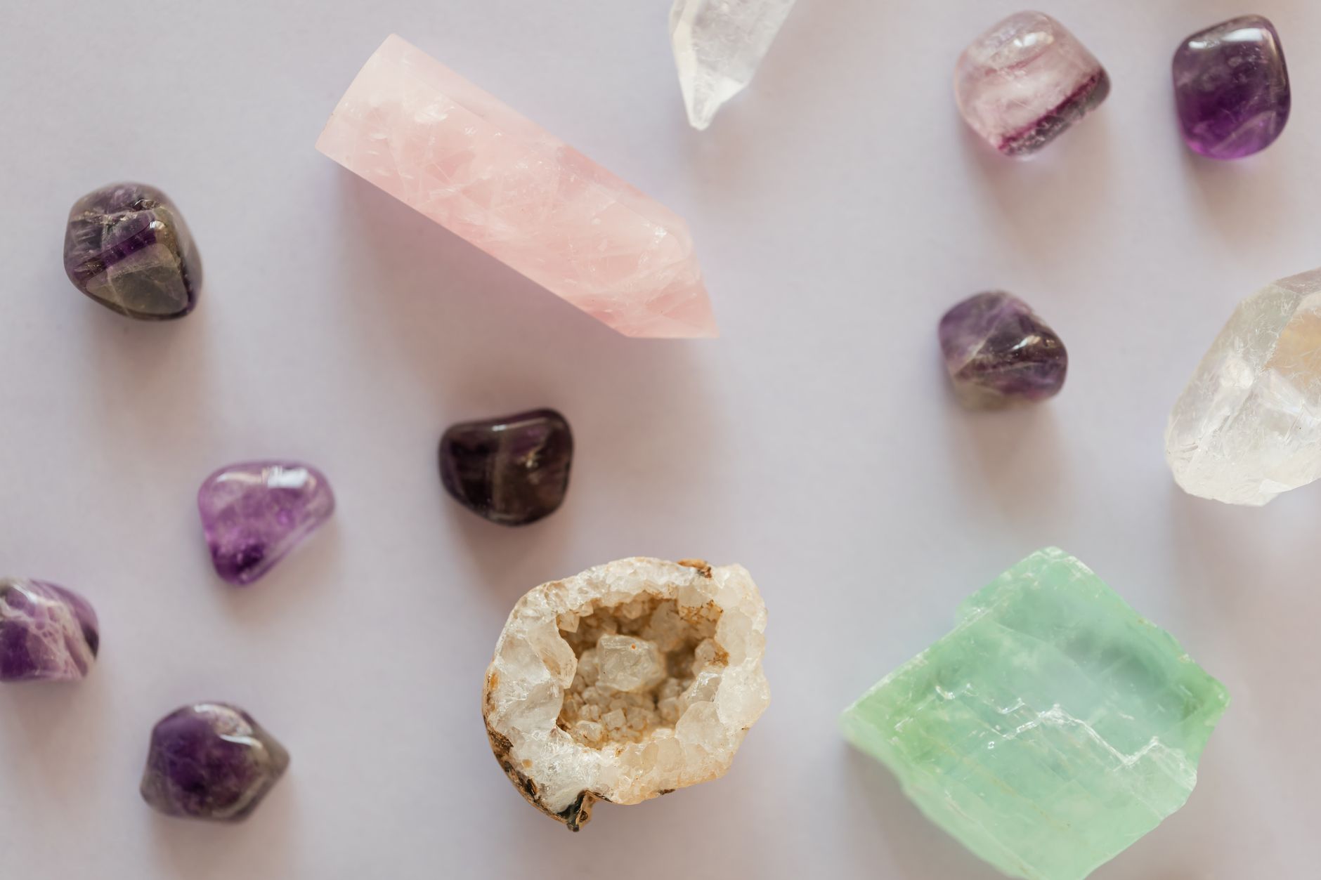rough agates and jasper pieces gathered on a rocky surface